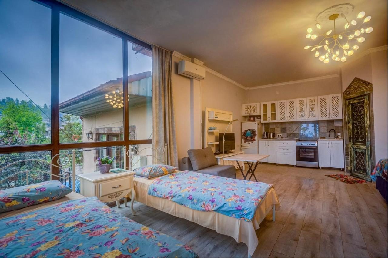 Standard double room with floor-to-ceiling windows onto the garden